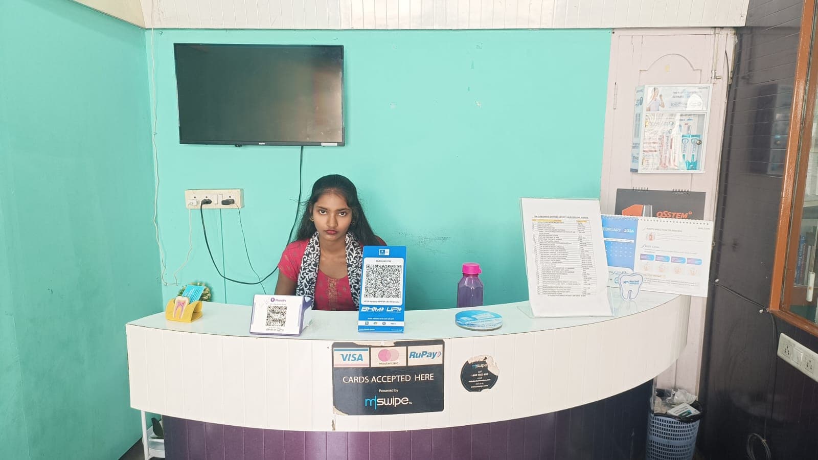 A patient and dentist interacting in a friendly manner.